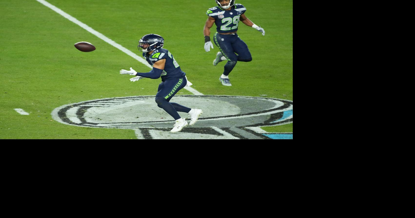 Feb 8, 2026; Santa Clara, CA, USA; Seattle Seahawks safety Julian Love (20) intercepts a pass against the New England Patriots in the second half in Super Bowl LX at Levi's Stadium. Mandatory Credit: Kirby Lee-Imagn Images