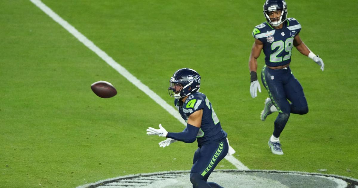 Feb 8, 2026; Santa Clara, CA, USA; Seattle Seahawks safety Julian Love (20) intercepts a pass against the New England Patriots in the second half in Super Bowl LX at Levi's Stadium. Mandatory Credit: Kirby Lee-Imagn Images