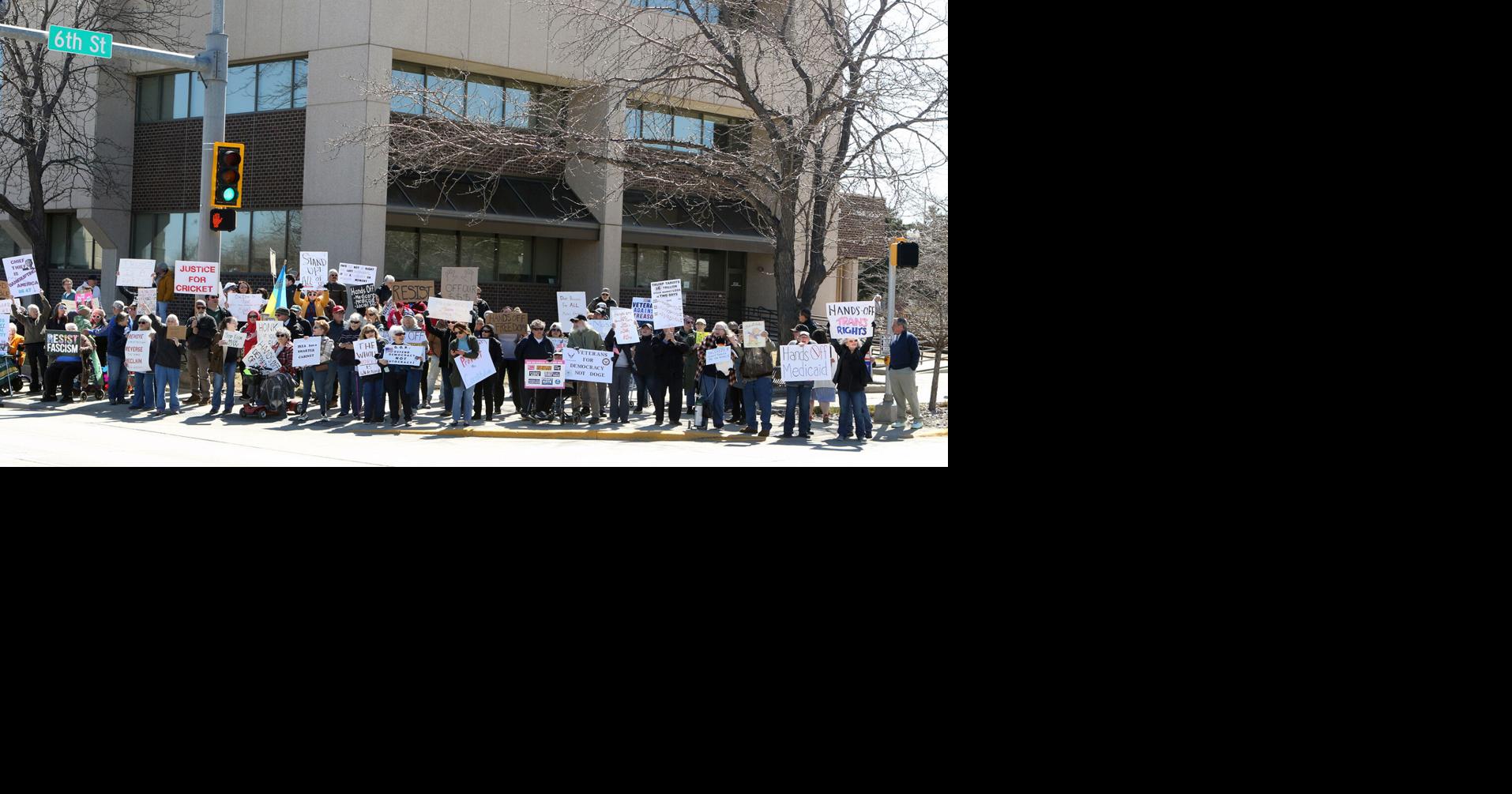 PHOTOS- Protestors line Omaha Street in Rapid City