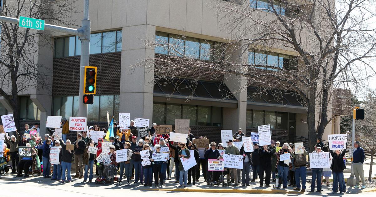PHOTOS- Protestors line Omaha Street in Rapid City