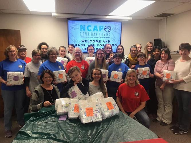 Volunteers repackage 13,000 diapers