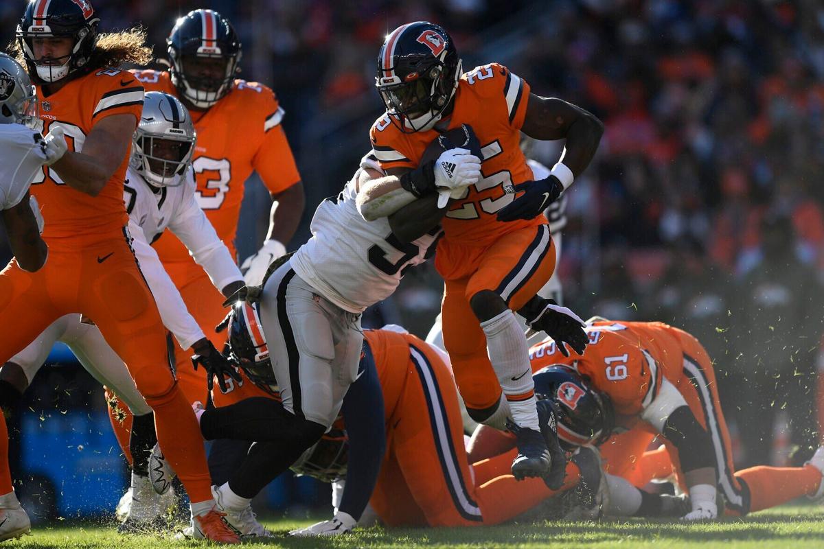 Melvin Gordon III of the Denver Broncos rushes for yards in the first quarter of a game against the Las Vegas Raiders at Empower Field At Mile High on Nov. 20, 2022, in Denver.