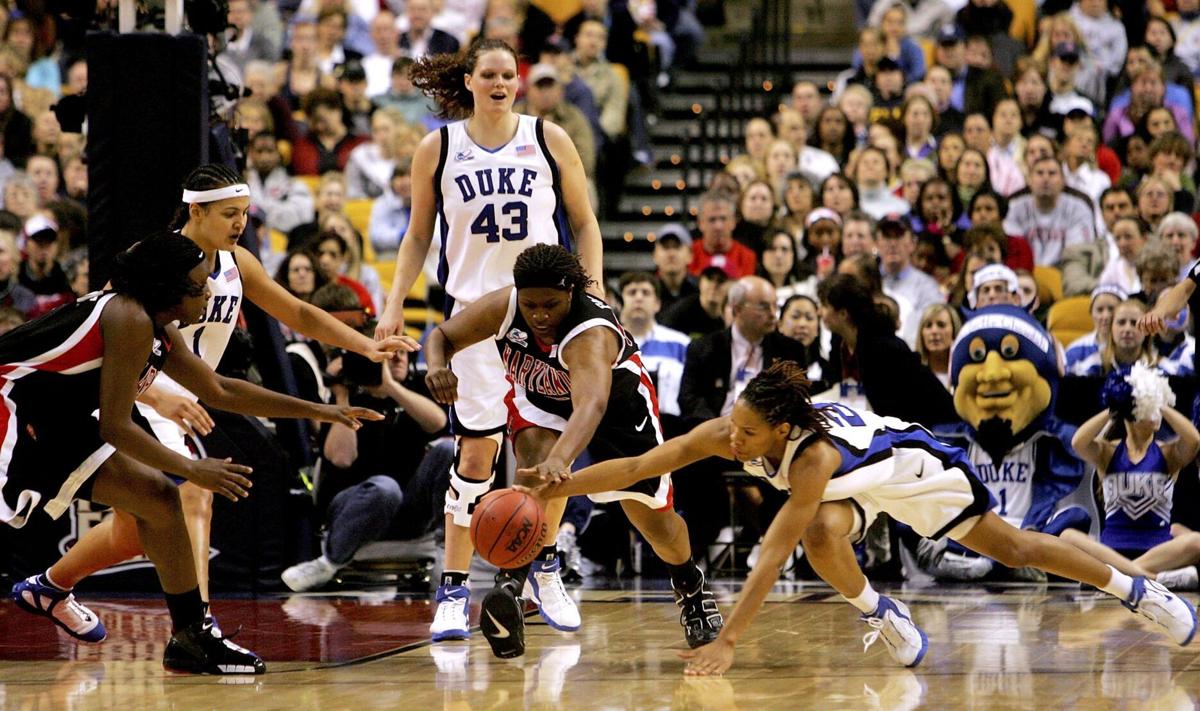 Jade Perry #55, center, and Crystal Langhorne #1, far left, of the Maryland Terrapins fight for a loose ball with Monique Currie #25, right, Mistie Williams#, and Alison Bales #43, all of the Duke Blue Devils, during the 2006 NCAA Women's Basketball Championship Game on April 4, 2006 at the TD Banknorth Garden in Boston, Massachusetts.