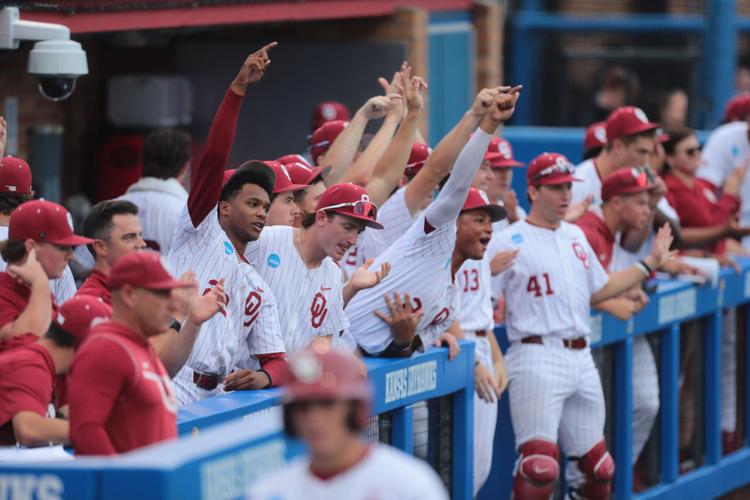 Oklahoma Sooners players celebrate a play against Kansas Jayhawks during the NCAA Lawrence Super Regional game at Hoglund Ballpark on June 7, 2026.
