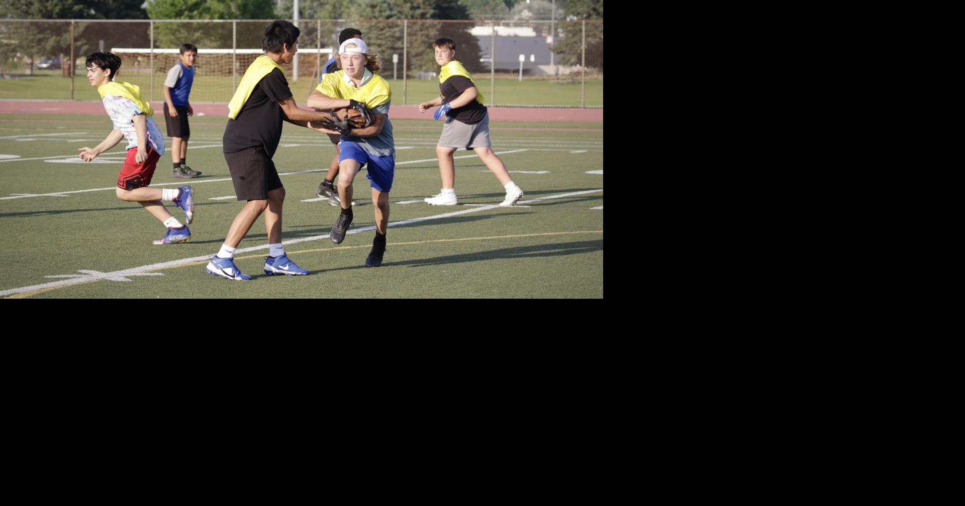 NFL players coach youth football camp in Rapid City