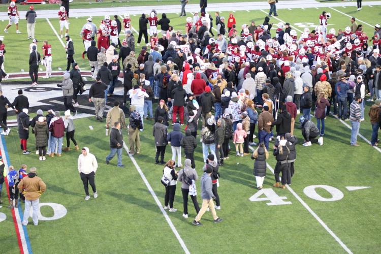 FB--Many fans on the field 0366.JPG