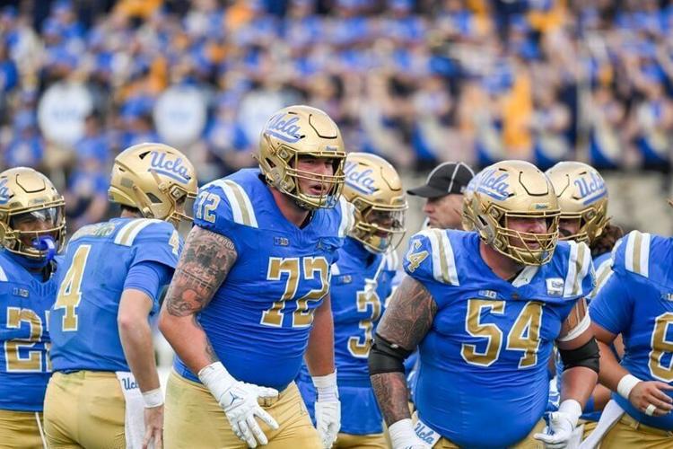 Nov 30, 2024; Pasadena, California, USA; UCLA Bruins offensive linemen Garrett DiGiorgio (72) and Josh Carlin (54) during the second quarter against the Fresno State Bulldogs at Rose Bowl. Mandatory Credit: Robert Hanashiro-Imagn Images