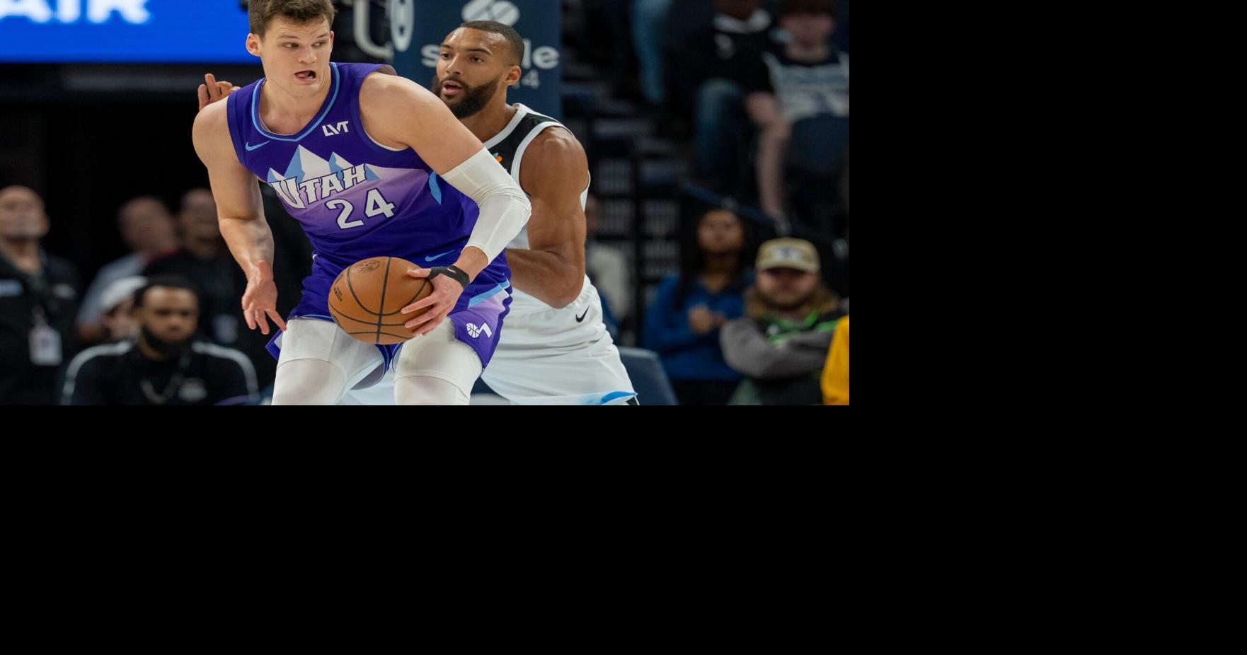 Mar 16, 2025; Minneapolis, Minnesota, USA; Utah Jazz center Walker Kessler (24) backs towards the basket as Minnesota Timberwolves center Rudy Gobert (27) plays defense in the first half at Target Center. Mandatory Credit: Jesse Johnson-Imagn Images