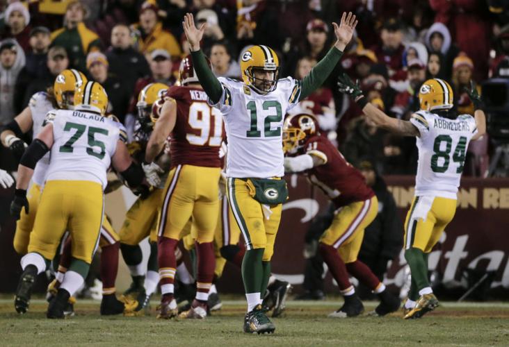 After slow start, Rodgers, Packers overwhelm Redskins 35-18