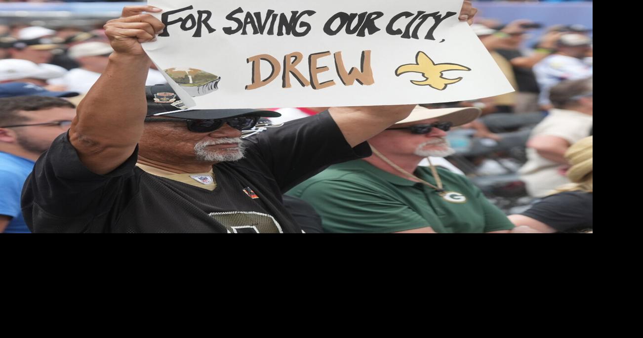 A fan holds up a sign for Drew Brees at the Pro Football Hall of Fame induction ceremony at the Pro Football Hall of Fame ,