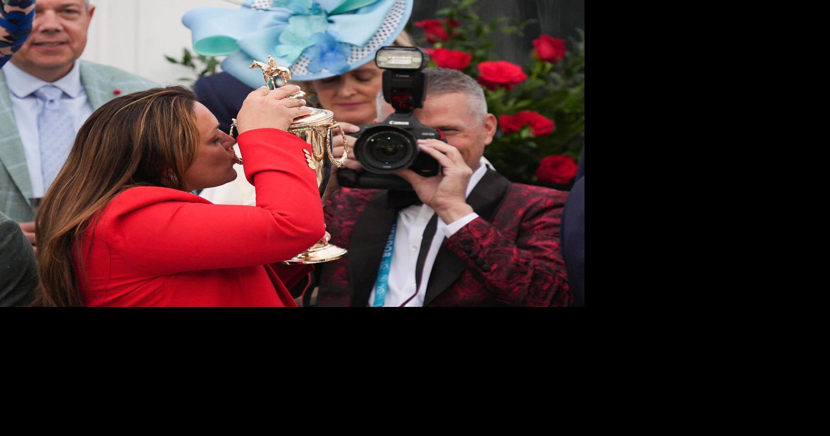 Trainer Cherie DeVaux kisses the trophy after her horse Golden Tempo with Jose L. Ortiz won the 2026 Kentucky Derby at Churchill