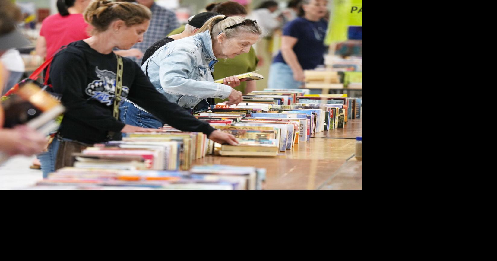 Shoppers look for book bargains during the Great American Book Sale inside the Flo Fabrizio Ice Center in Erie, Pa., on June 14, 2026.