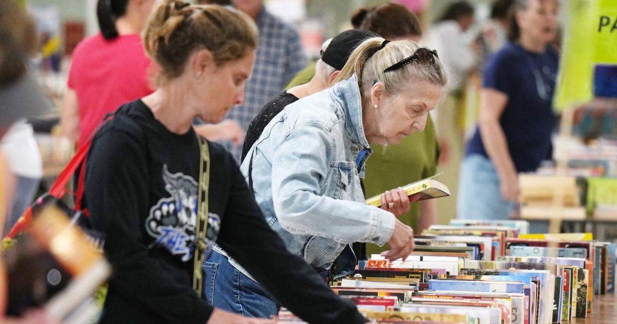 Shoppers look for book bargains during the Great American Book Sale inside the Flo Fabrizio Ice Center in Erie, Pa., on June 14, 2026.