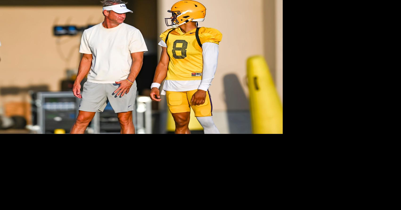 LSU Tigers head football coach Lane Kiffin talking with Quarterback Husan Longstreet 8 at LSU Football practice. August 18,
