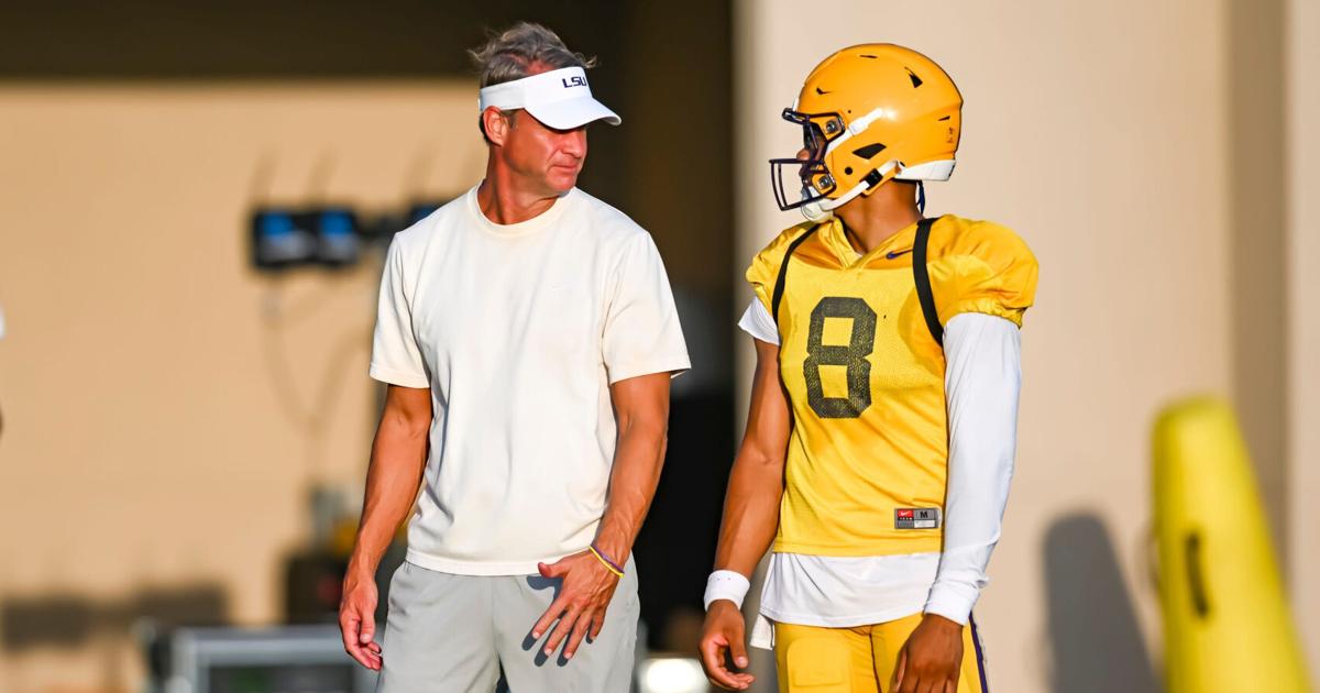 LSU Tigers head football coach Lane Kiffin talking with Quarterback Husan Longstreet 8 at LSU Football practice. August 18,