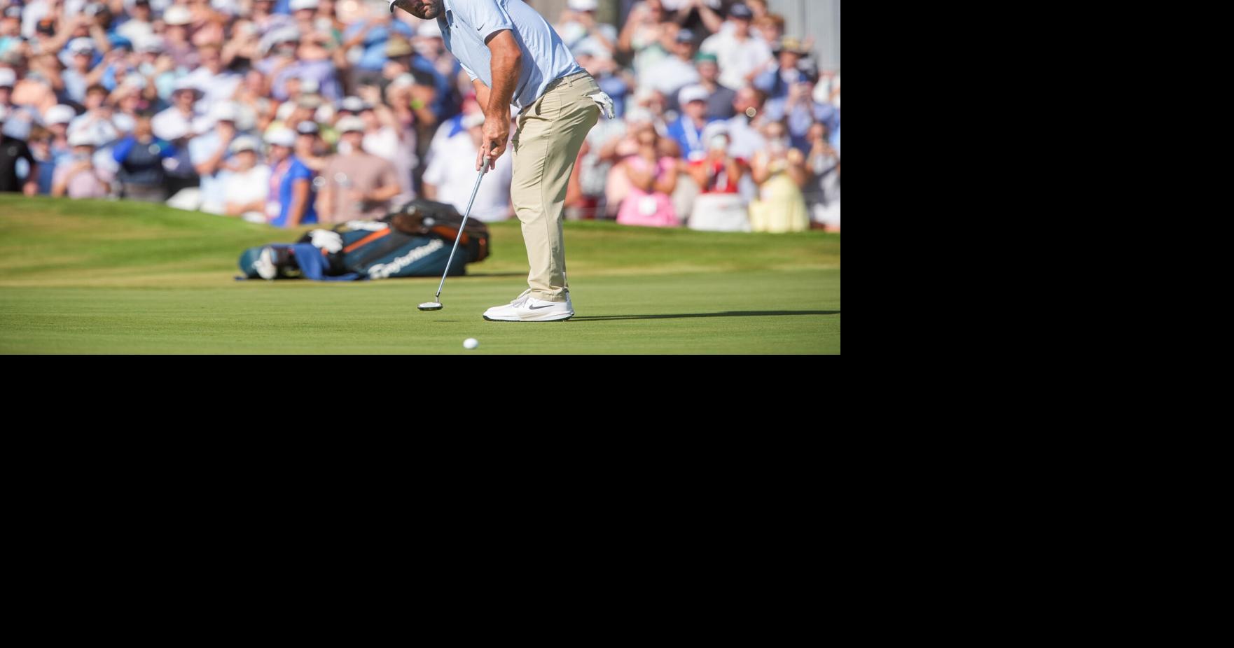 Scottie Scheffler putts on the 18th hole to win the FedEx St. Jude Championship with an eight stroke lead at TPC Southwind in