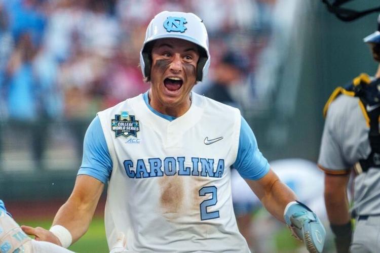 Jun 14, 2026; Omaha, NE, USA; North Carolina Tar Heels shortstop Jake Schaffner (2) reacts after scoring on a two-run triple by second baseman Gavin Gallaher (not pictured) against the West Virginia Mountaineers during the seventh inning at Charles Schw...