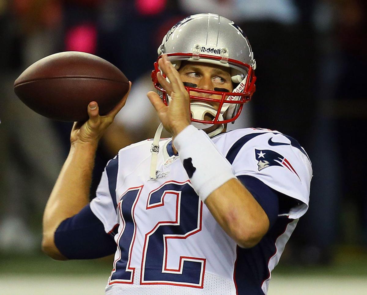 New England Patriots quarterback Tom Brady warms up before a 2013 game against the Atlanta Falcons in Atlanta.