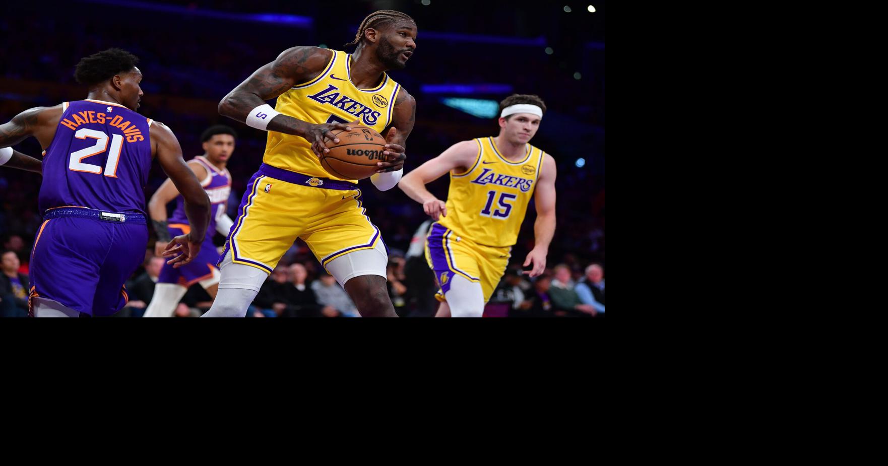 Los Angeles Lakers center DeAndre Ayton (5) gets the rebound against the Phoenix Suns during the first half at Crypto Arena on Dec. 1, 2025.
