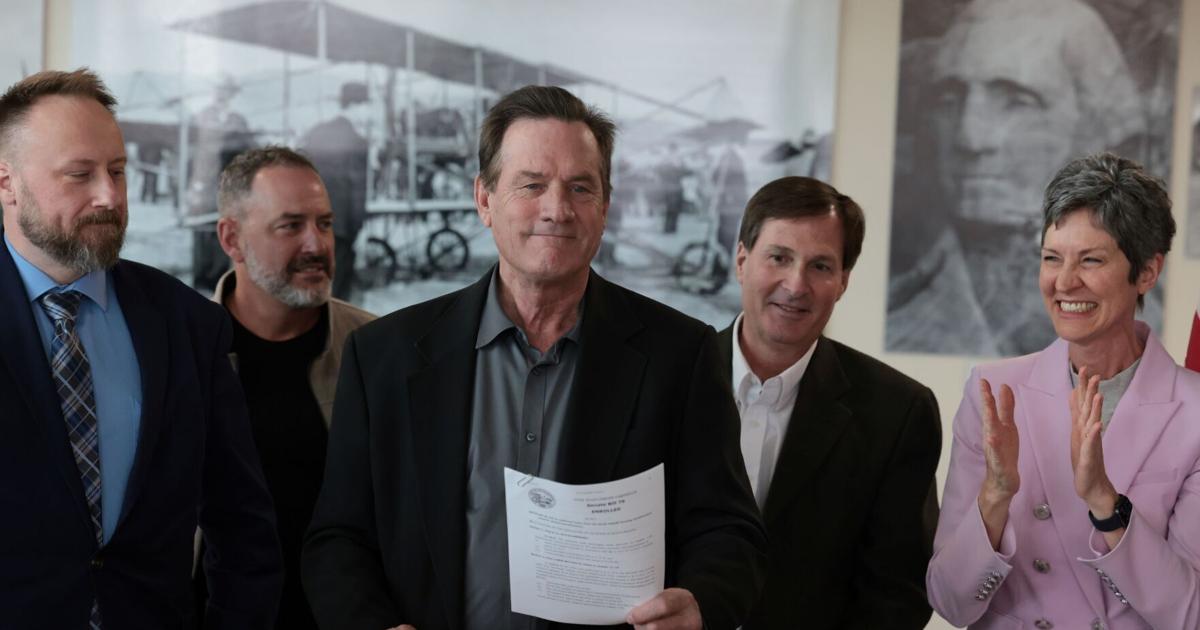 Roger Rhoden Rhoden signs airport $15 million loan bill during ceremony in Rapid City