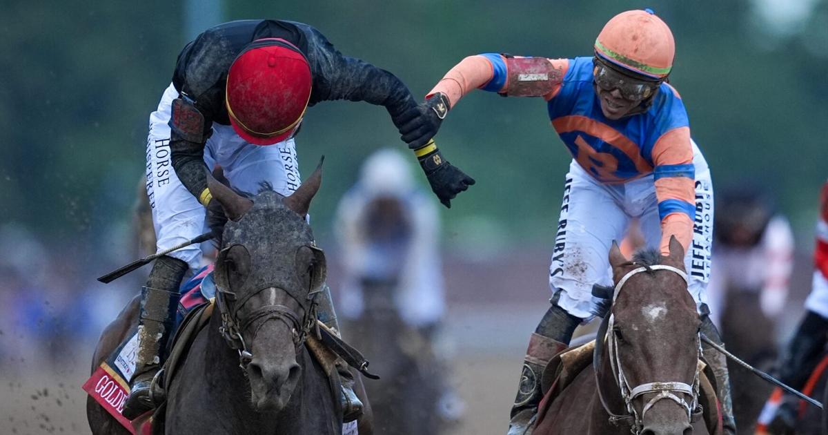 Golden Tempo, with Jose Ortiz up, left, gets congratulated by his brother, Irad, aboard Reneegade, after he wins the Kentucky