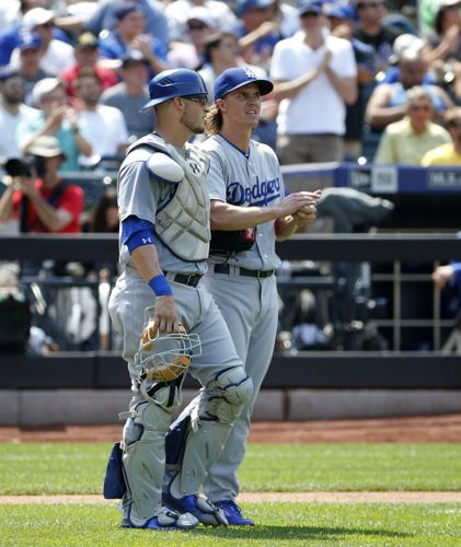 Greinke outpitched by Hellickson in Angels' debut