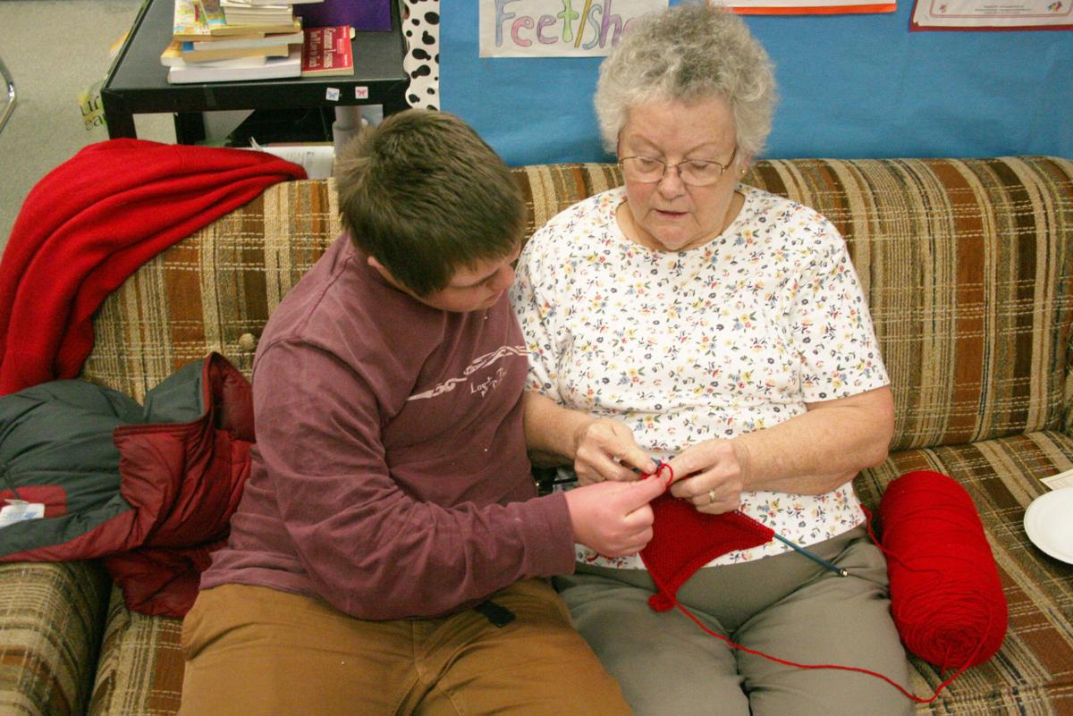 Knit together Volunteers teach middle school students the art of