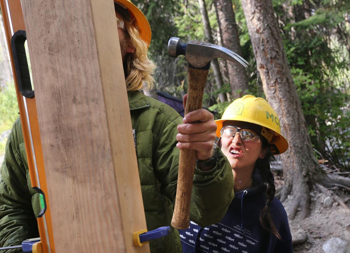 Bridge builders Montana Conservation Corps crew members construct span