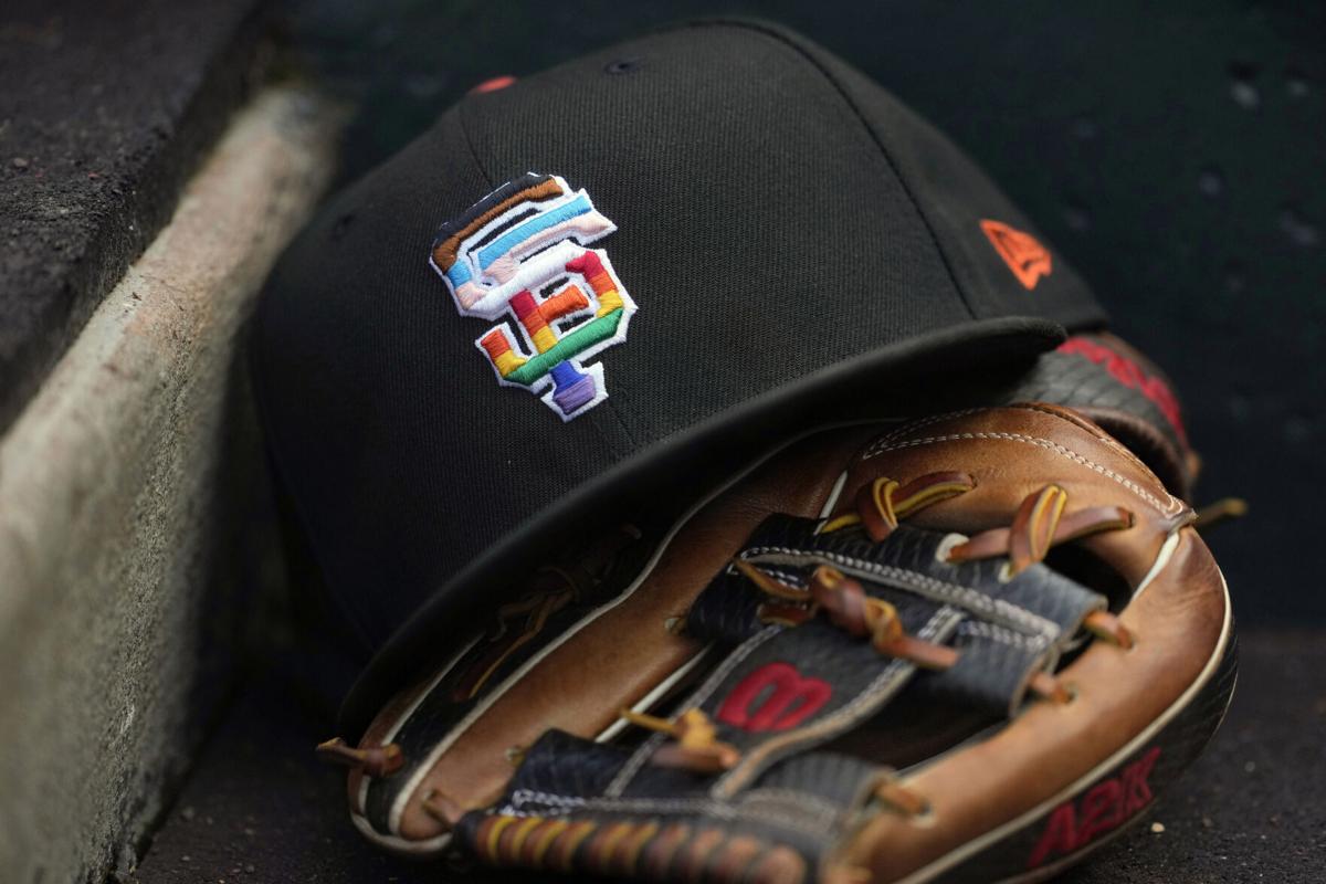 Fans receive San Francisco Giants Pride Jerseys as part of the team's Pride  Day promotional giveaway as they enter Oracle Park before a baseball game  between the Giants and the Chicago Cubs