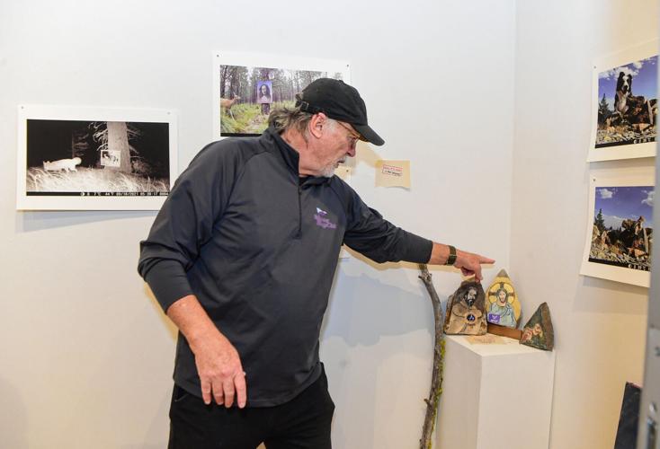 Jim Baken displays artwork for animals at Rocky