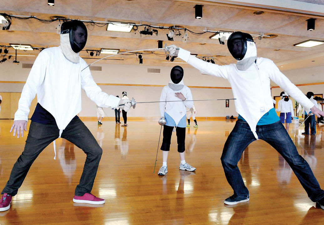 Duel workout UM fencing club attracts students who want both mind