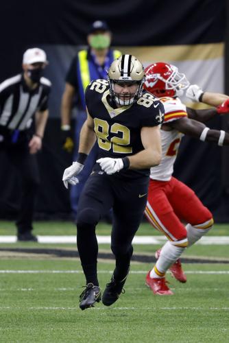 New Orleans Saints tight end Adam Trautman (82) wears a Salute to Service  towel during an NFL football game against the Los Angeles Rams, Sunday,  Nov. 20, 2022, in New Orleans. (AP