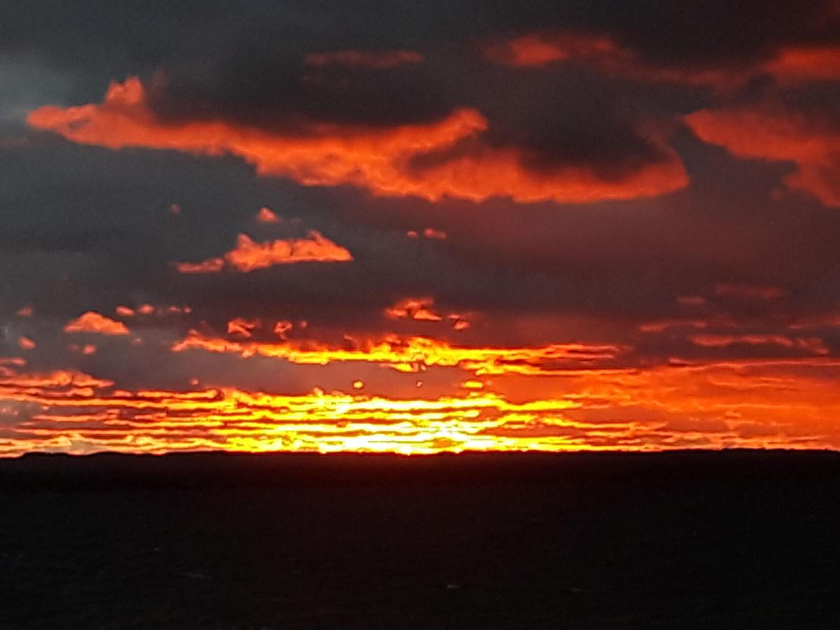 goeyes101520Sunset in the rain over East Bay. Photo by Ken Beck..jpg