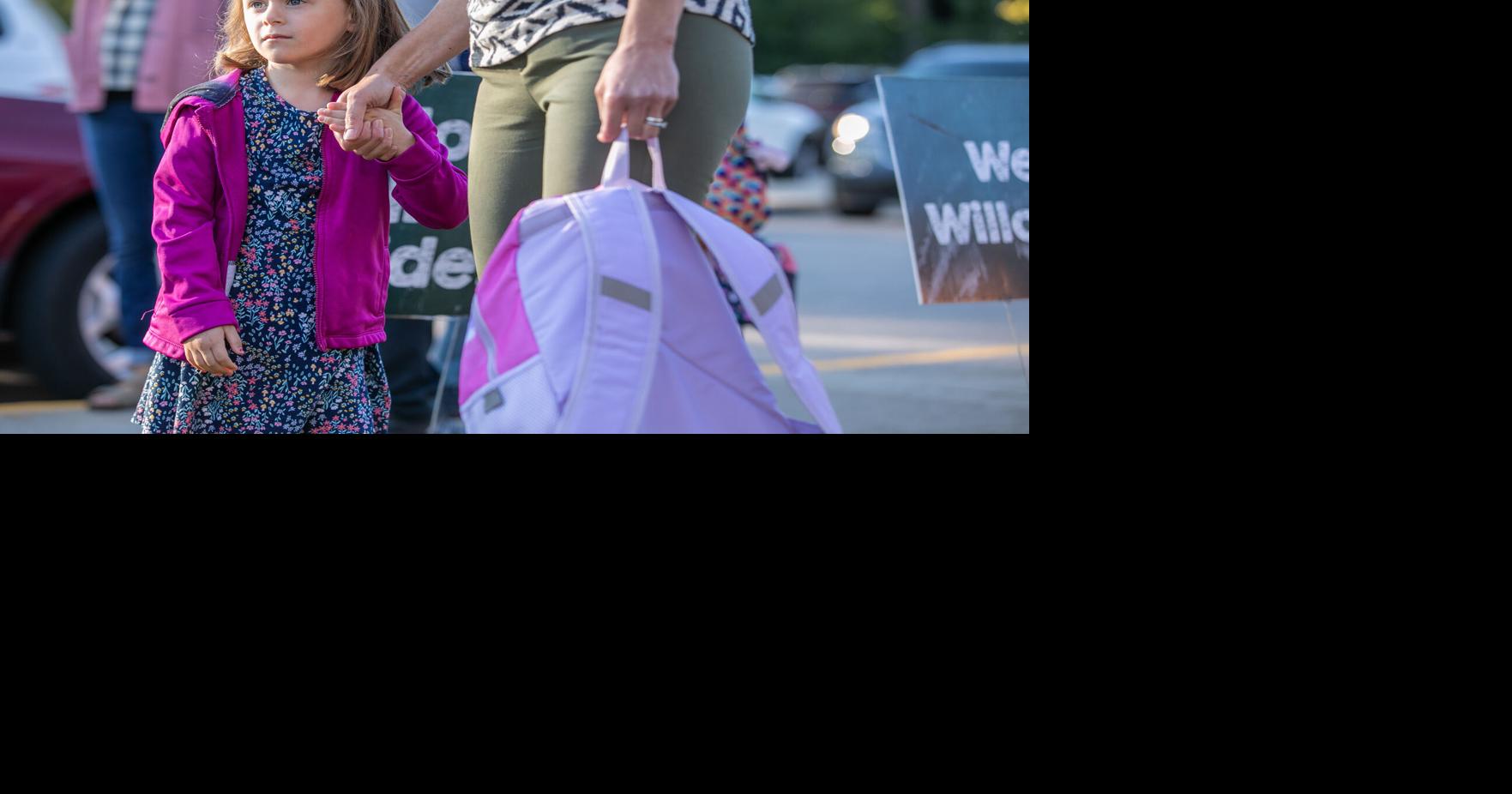 Glad to be back: Teachers, parents greet first day of school with high ...