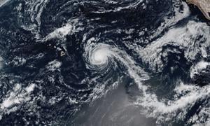 Kiko weakens into a tropical storm but still could create dangerous surf in Hawaii