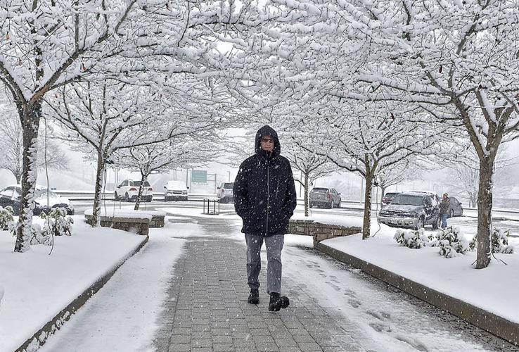 Slushy snow tapering but more Tuesday; January temps later this week