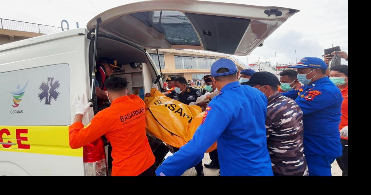 Indonesian rescuers find a body while searching for Spanish soccer coach and 3 children