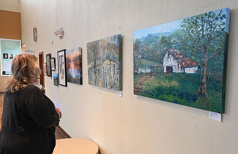 Local artist hangs exhibit at newspaper | Life | register-herald.com