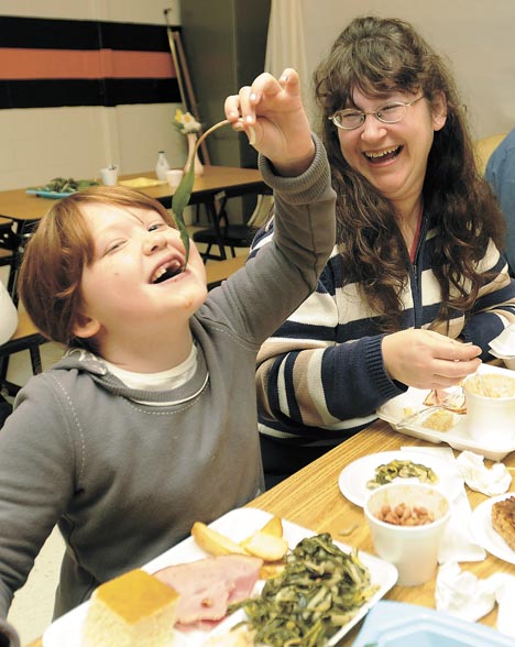 ramped up in richwood register herald com anna france left gets ready to eat a raw ramp during the ramp festival in richwood as her mother tammy france of barboursville looks on