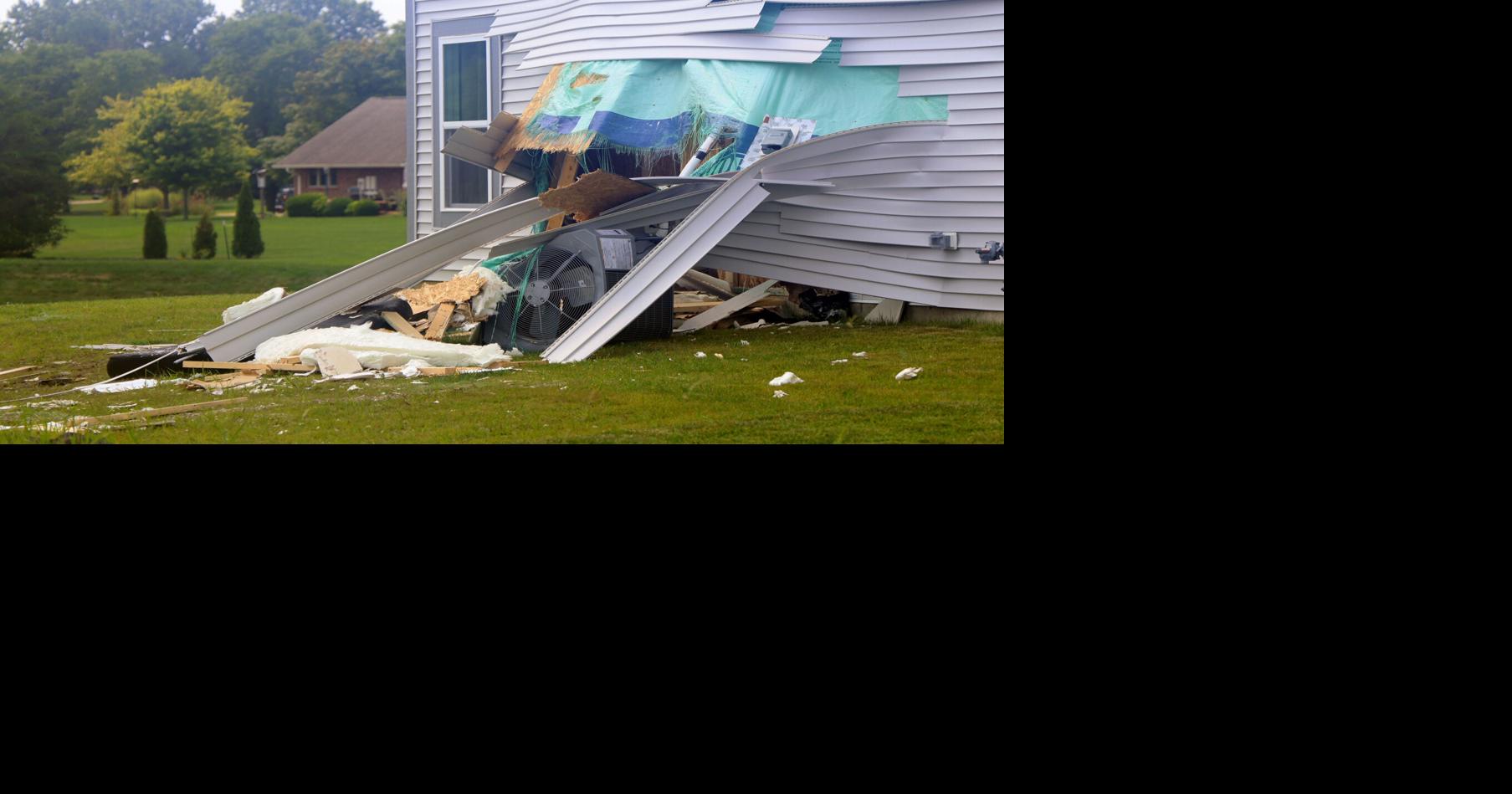 Couple injured when car runs through their home
