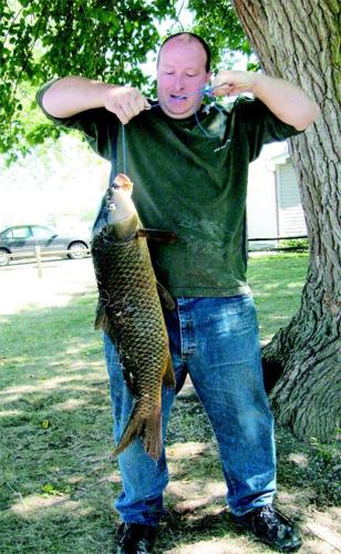 Holy carp!: Fisherman pulls 15-lb. fish from Hot Pond