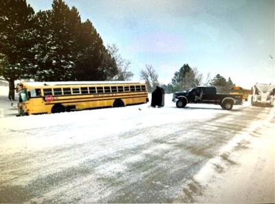 Snowy, icy conditions cause truck to crash into school bus | Local News ...