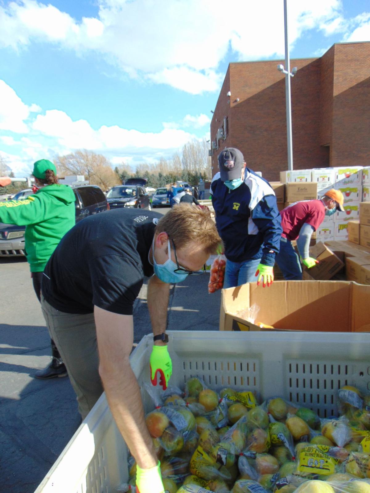 Emergency Food Distribution workers provide 500 boxes to area families