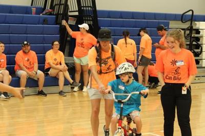 iCan Bike Program teaches local people with disabilities how to ride a ...