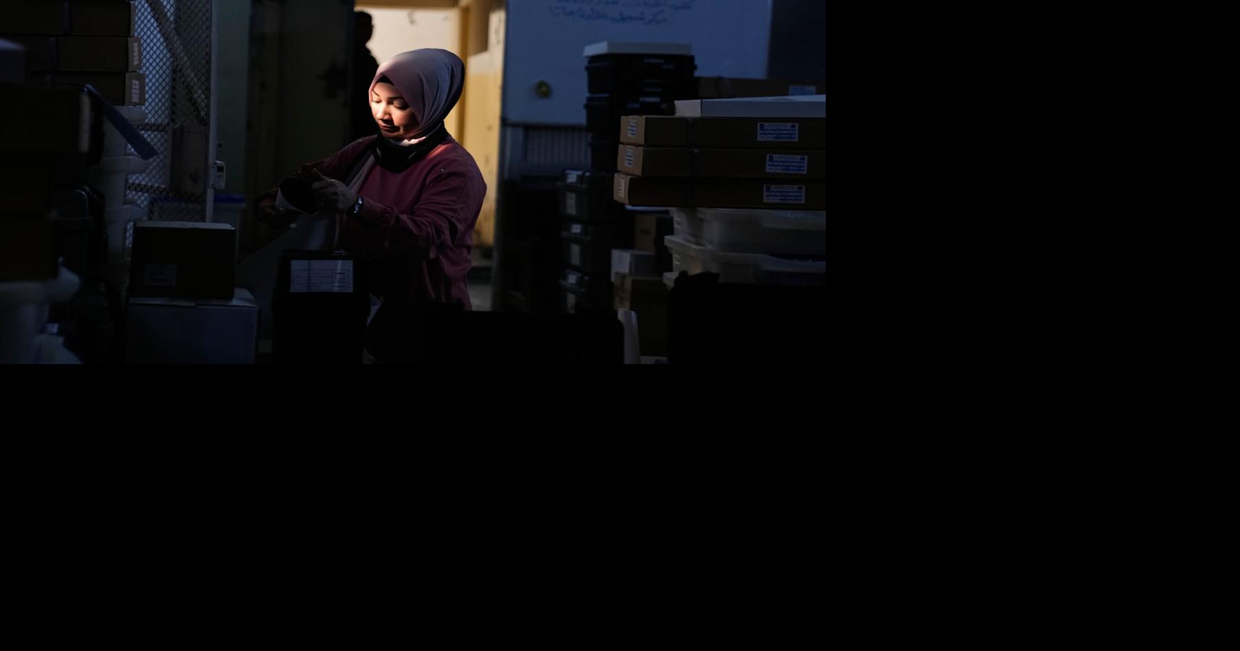 Photos show Iraqi security forces and displaced people voting early in parliamentary election