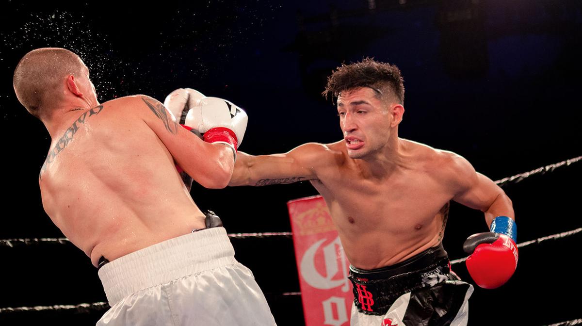 Brandon Holmes punches Gene Perez