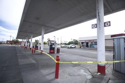 gas shooting station marks fatal investigated espaola boundaries crime tape police thursday following scene being