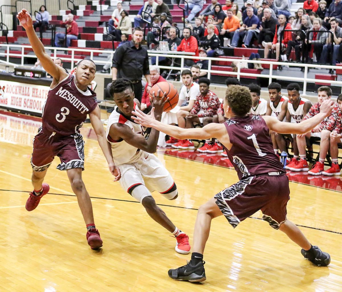 Friday basketball Heath boys take district lead Sports