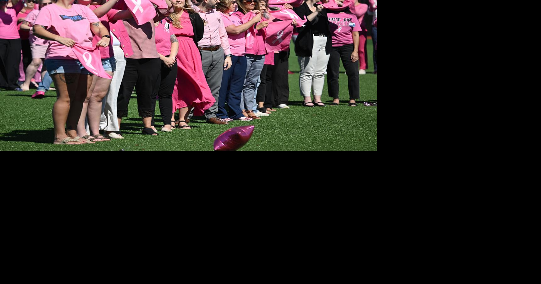 SENTINEL SNAPSHOT: Human pink ribbon promotes breast cancer awareness ...