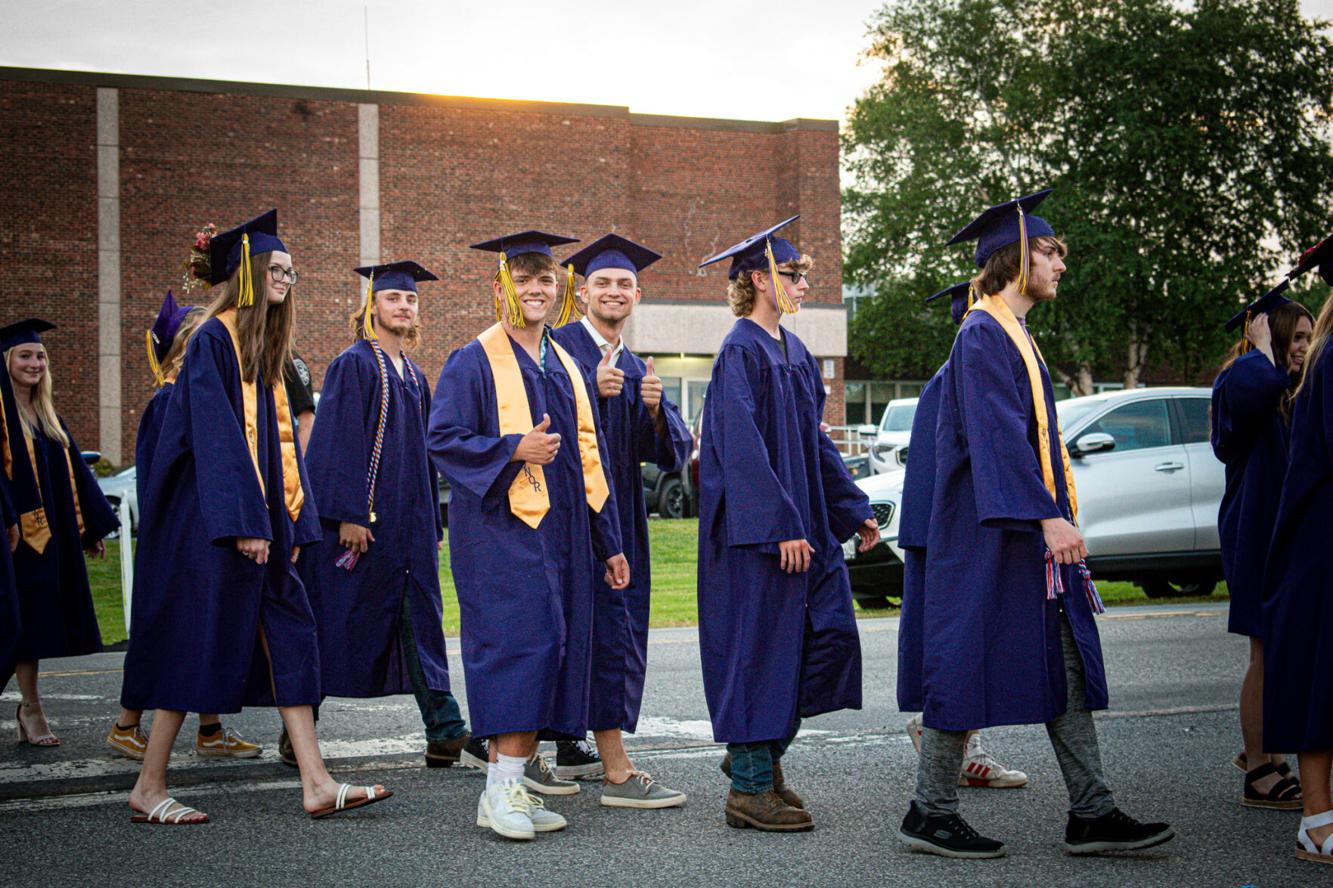 Holland Patent grads walking toward field